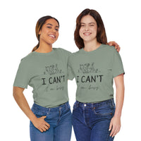 I Can’t, I’m Busy Unisex Jersey Short Sleeve TeeShow off your love for quiet moments with our I Can’t, I’m Busy Unisex Jersey Short Sleeve Tee. Perfect for book lovers and those who cherish their downtime, this tee features a playful illustration of a per