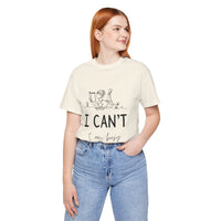 I Can’t, I’m Busy Unisex Jersey Short Sleeve TeeShow off your love for quiet moments with our I Can’t, I’m Busy Unisex Jersey Short Sleeve Tee. Perfect for book lovers and those who cherish their downtime, this tee features a playful illustration of a per