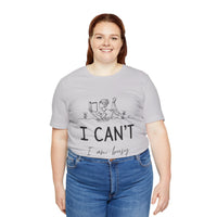 I Can’t, I’m Busy Unisex Jersey Short Sleeve TeeShow off your love for quiet moments with our I Can’t, I’m Busy Unisex Jersey Short Sleeve Tee. Perfect for book lovers and those who cherish their downtime, this tee features a playful illustration of a per