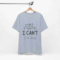 I Can’t, I’m Busy Unisex Jersey Short Sleeve TeeShow off your love for quiet moments with our I Can’t, I’m Busy Unisex Jersey Short Sleeve Tee. Perfect for book lovers and those who cherish their downtime, this tee features a playful illustration of a per