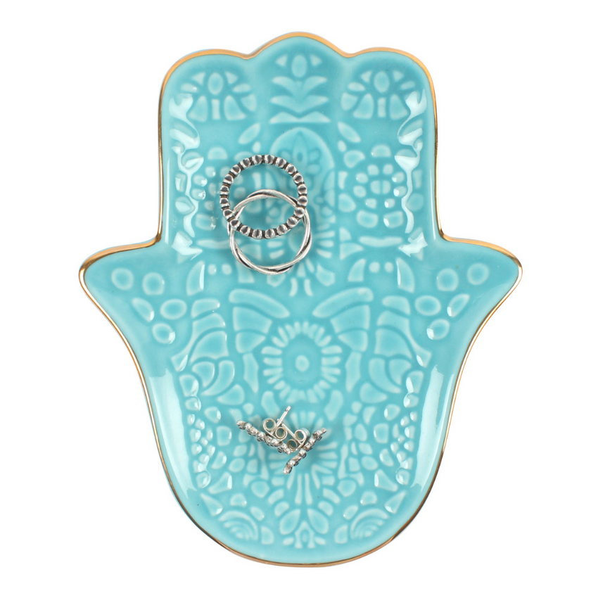 Turquoise Hamsa Hand Jewellery Dish Elevate your decor with our stunning Turquoise Hamsa Hand Jewellery Dish. This handcrafted ceramic dish is perfect for organizing rings, earrings, and bracelets. Its vibrant turquoise color and intricate hamsa design sy