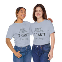 I Can’t, I’m Busy Unisex Jersey Short Sleeve TeeShow off your love for quiet moments with our I Can’t, I’m Busy Unisex Jersey Short Sleeve Tee. Perfect for book lovers and those who cherish their downtime, this tee features a playful illustration of a per