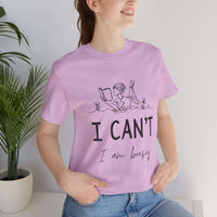 I Can’t, I’m Busy Unisex Jersey Short Sleeve TeeShow off your love for quiet moments with our I Can’t, I’m Busy Unisex Jersey Short Sleeve Tee. Perfect for book lovers and those who cherish their downtime, this tee features a playful illustration of a per