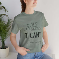 I Can’t, I’m Busy Unisex Jersey Short Sleeve TeeShow off your love for quiet moments with our I Can’t, I’m Busy Unisex Jersey Short Sleeve Tee. Perfect for book lovers and those who cherish their downtime, this tee features a playful illustration of a per