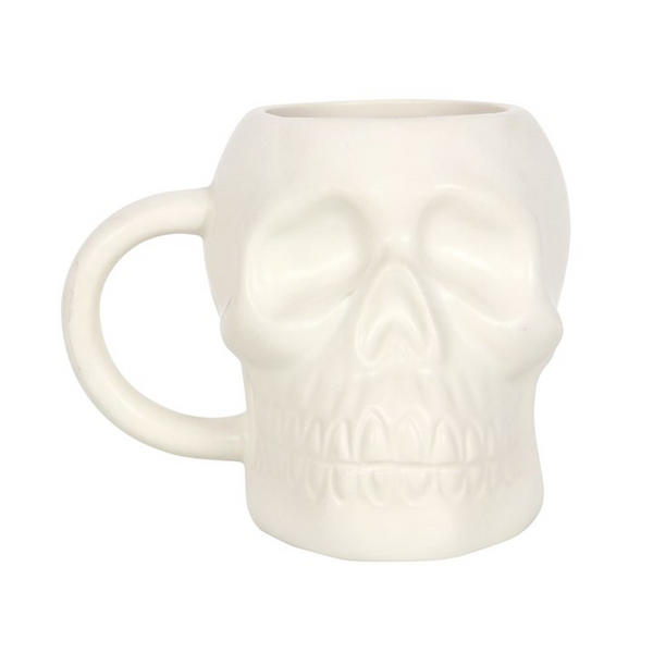 Matte white skull mug with 500ml capacity and handwash only instructions.