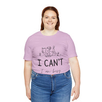 I Can’t, I’m Busy Unisex Jersey Short Sleeve TeeShow off your love for quiet moments with our I Can’t, I’m Busy Unisex Jersey Short Sleeve Tee. Perfect for book lovers and those who cherish their downtime, this tee features a playful illustration of a per